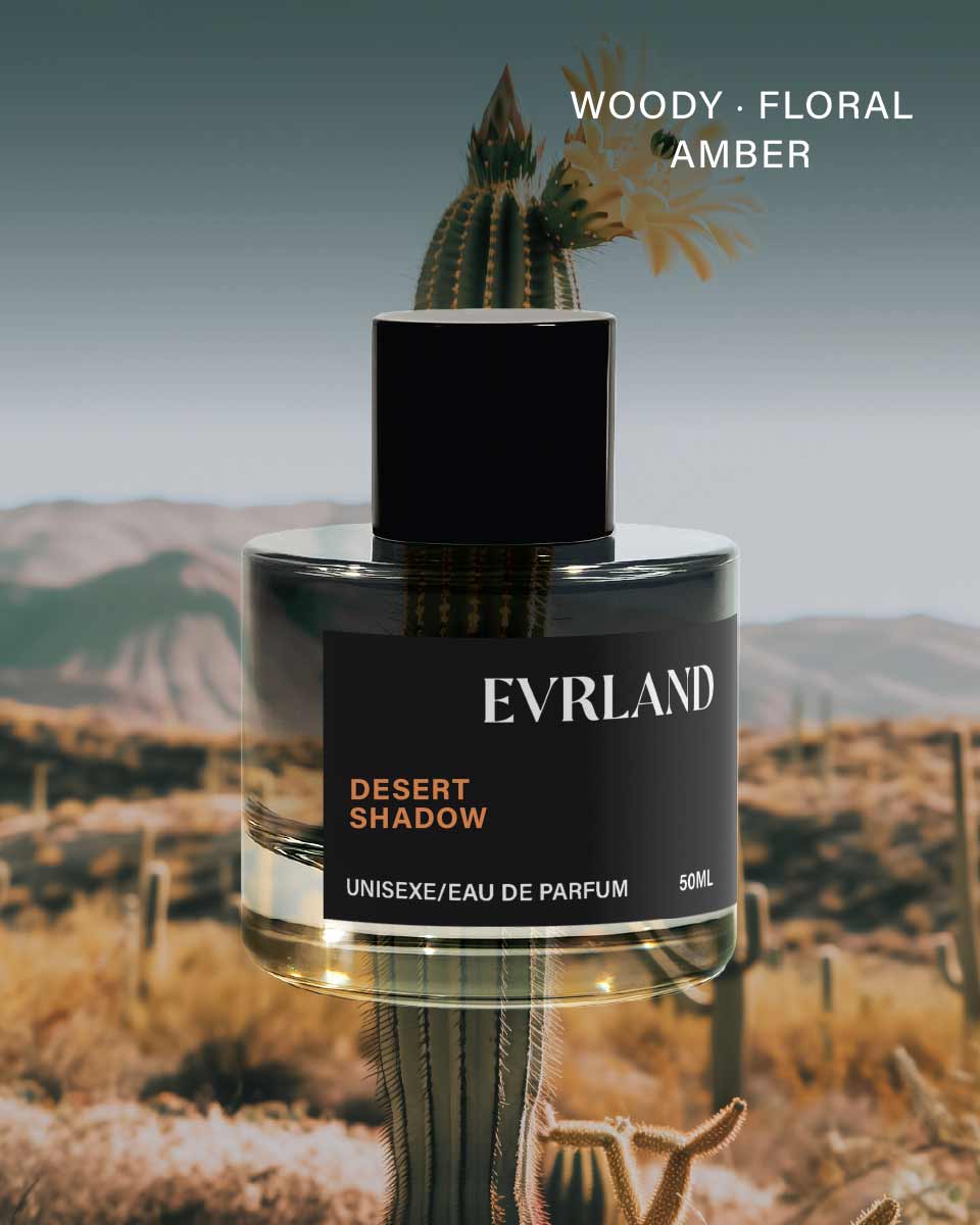 Perfume bottle labeled 'Everland Desert Shadow' with desert landscape in the background