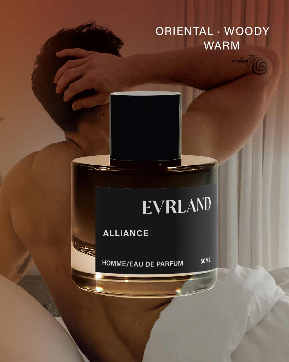 Evrland Alliance perfume bottle with a person sitting in the background