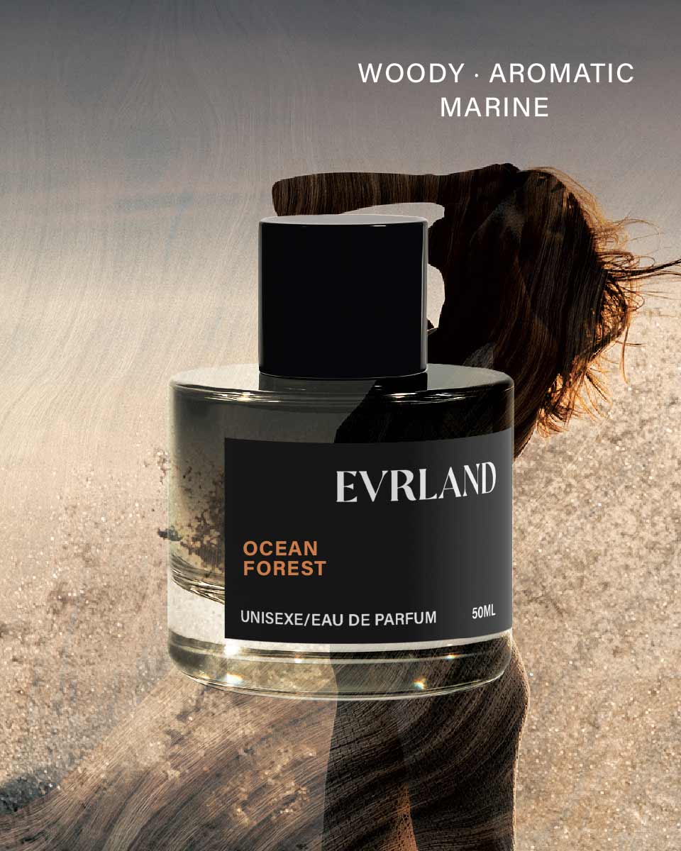 Perfume bottle labeled 'Everland Ocean Forest' with a blurred person in the background
