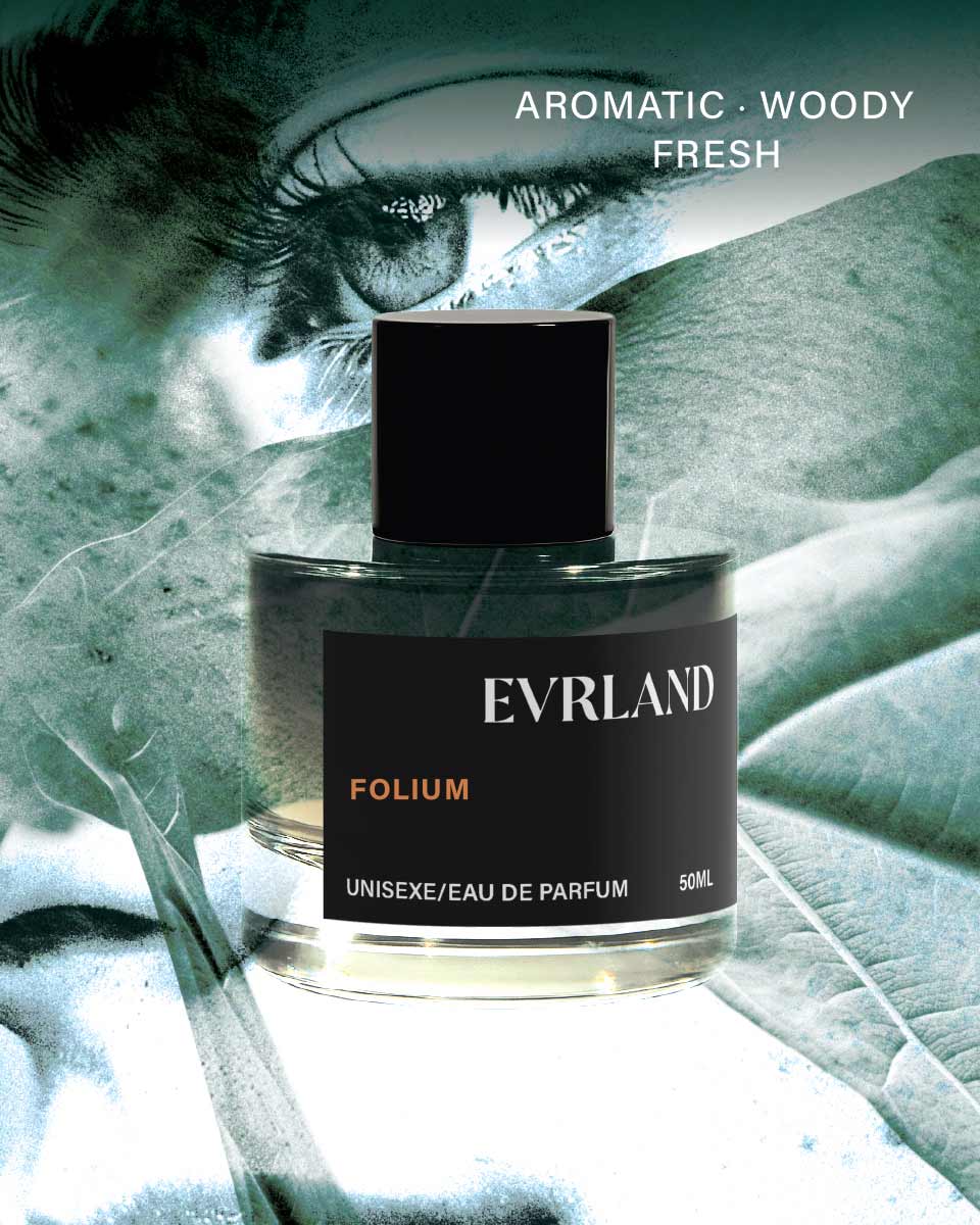 Perfume bottle labeled 'Evrland Folium' with a close-up of a person's eye in the background.