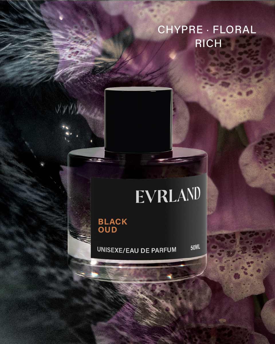 Evrland Black Oud perfume bottle with floral background