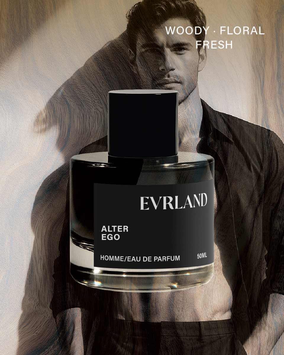 Perfume bottle labeled 'Evrland Alter Ego' held by a man with artistic background